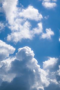 fluffy white clouds in a clear blue sky